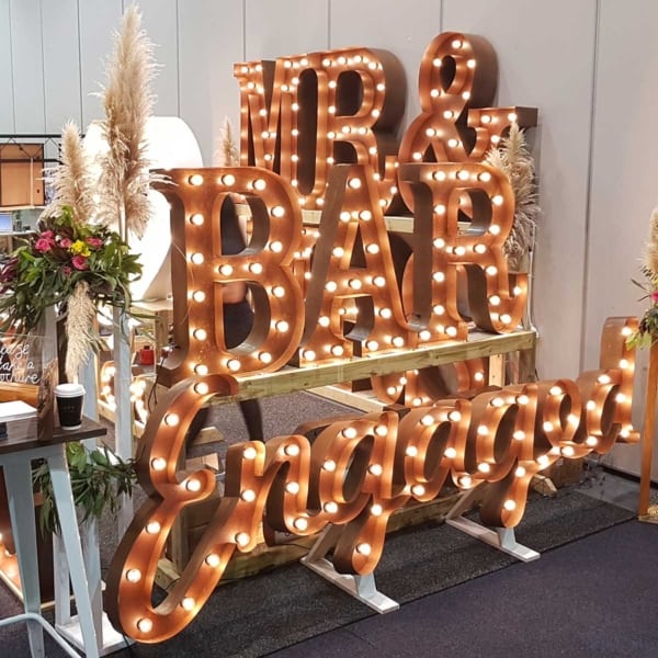 Giant light up BAR letters on display at a Perth wedding expo.