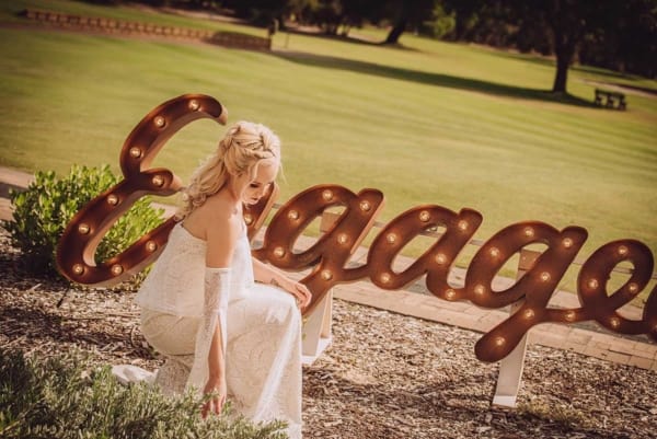 Giant light up Engaged LED letters at a park in Perth.