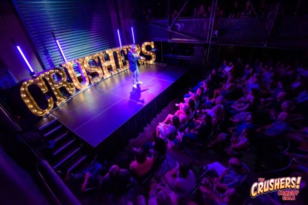 Giant letters on the stage at Crushers Comedy Gala.