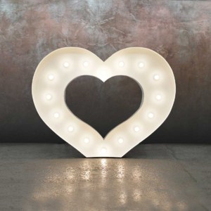 Giant white LED light up heart illuminating the floor.
