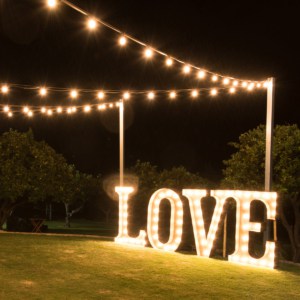 Giant light up love letters illuminating the lawns at Core Cider House.