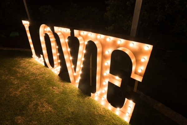 Giant light up LED love letters at night.