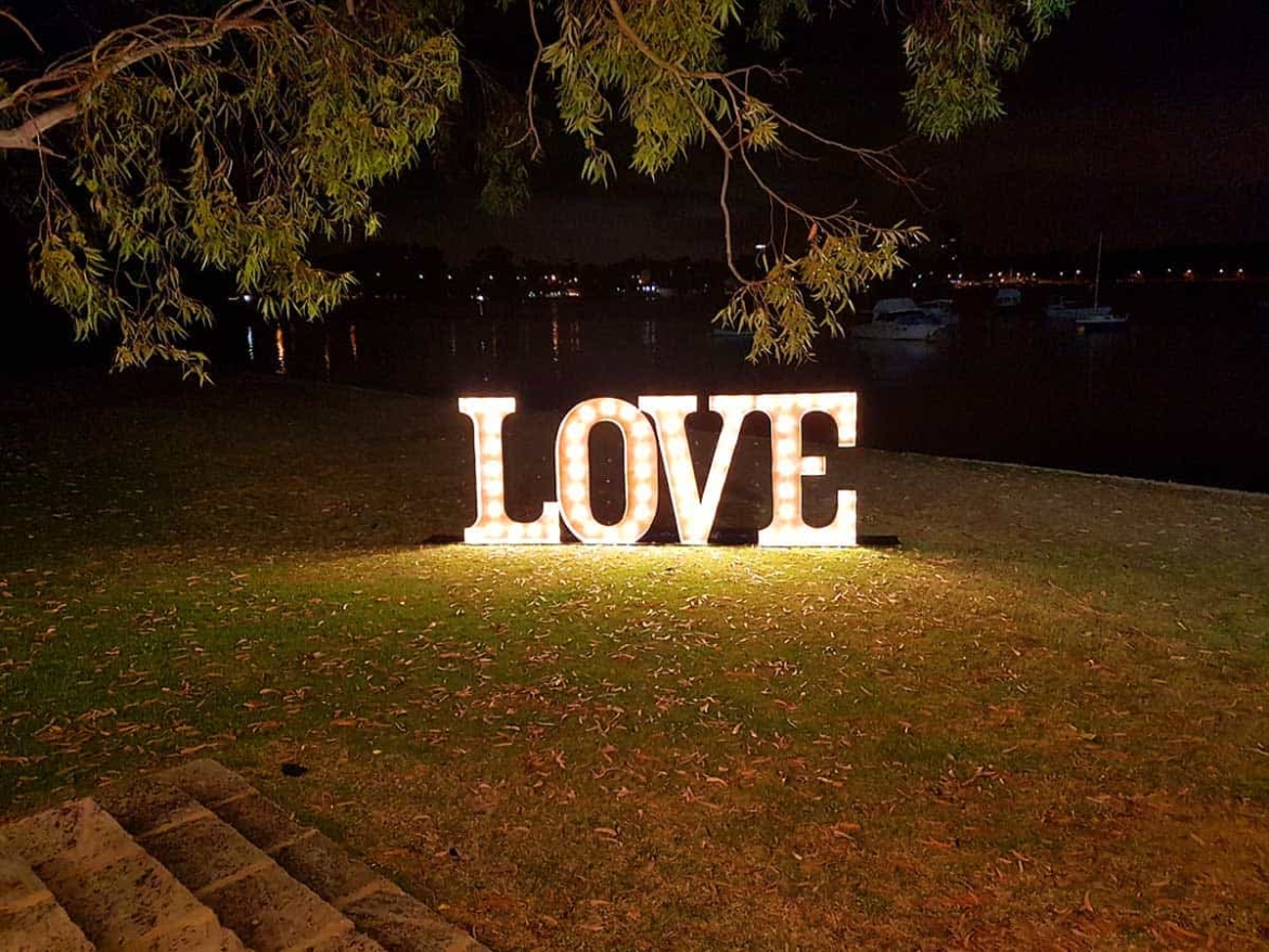 Giant-light-up-love-letters-under-tree.jpg