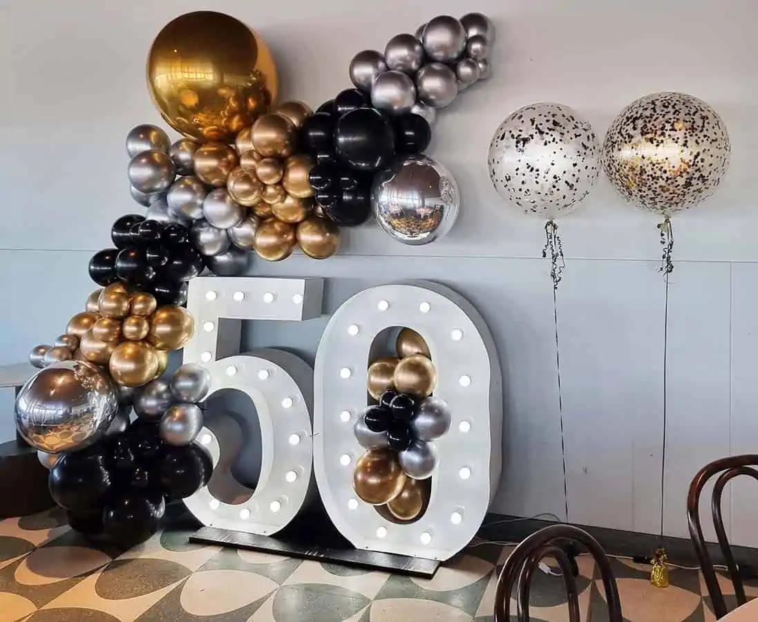 Giant-number-lights-with-silver-gold-balloons.jpg