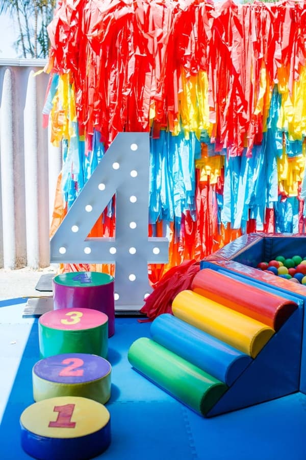 Giant light up numbers at a superhero themed 4th birthday party.