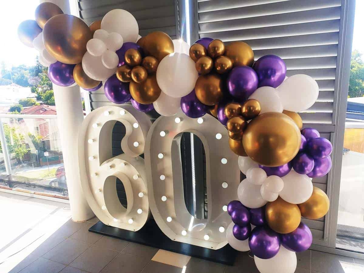 Giant-numbers-with-white-purple-gold-balloons.jpg