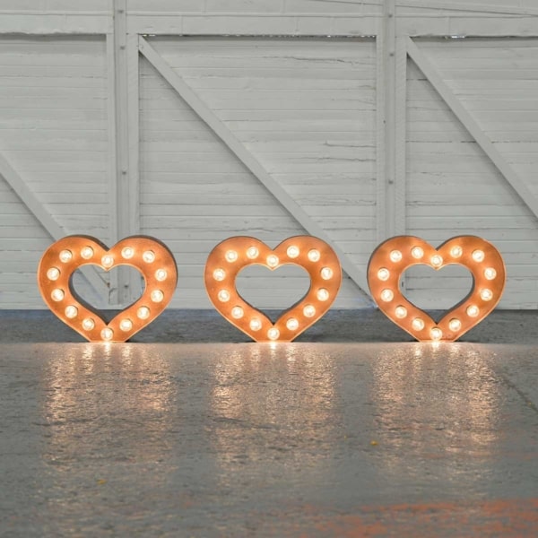 Light up small golden LED hearts lined up in a row.