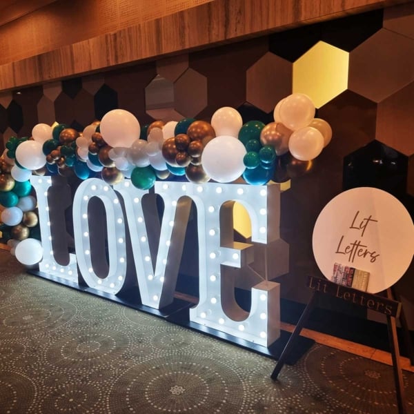 Giant white LED love letters and balloons at Duxton Hotel.