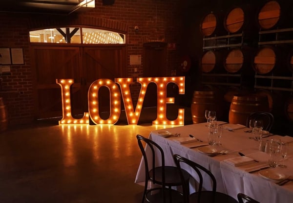 Giant golden light up Love letters in the cellar at Sandalford Wines.