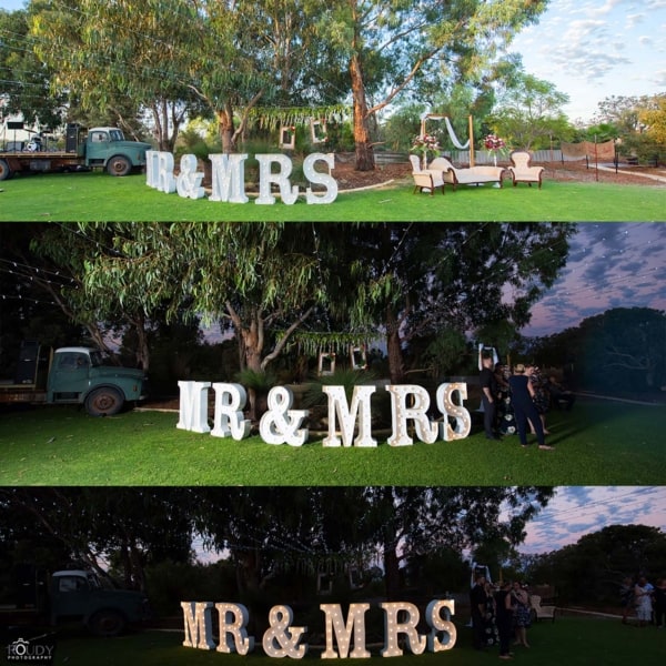 Giant MR & MRS light up letters at an outdoors wedding.