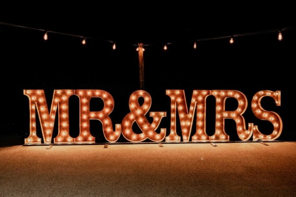Vintage gold light up MR & MRS letters shining in the dark.