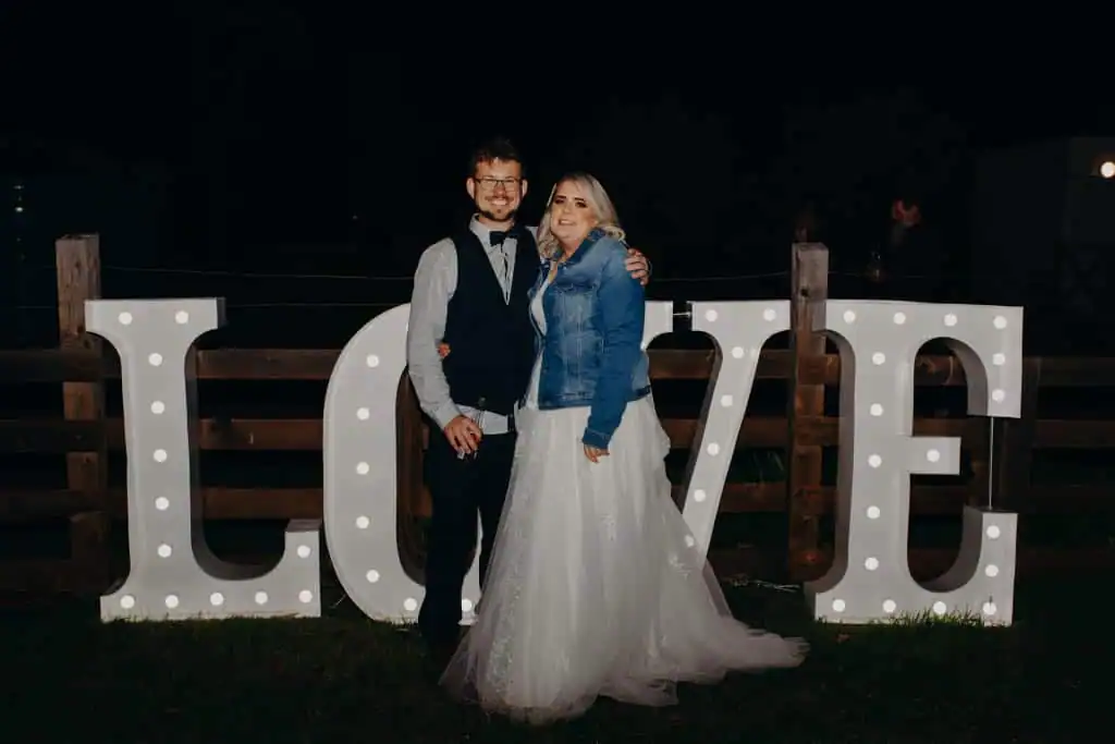 Light-up-love-letters-with-couple.webp